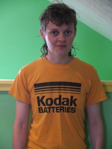 a photo of a "Kodak Batteries" t-shirt